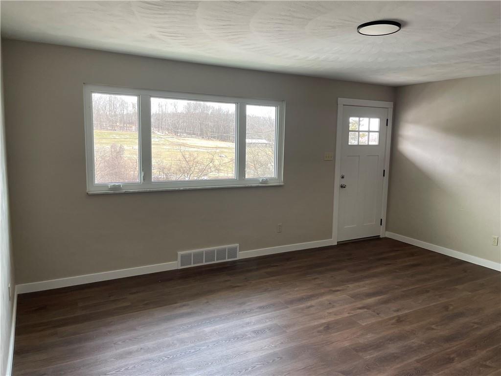 150 Watson Road Apollo, PA 15613 - Photo 9 of 21 an empty room with wooden floor and windows