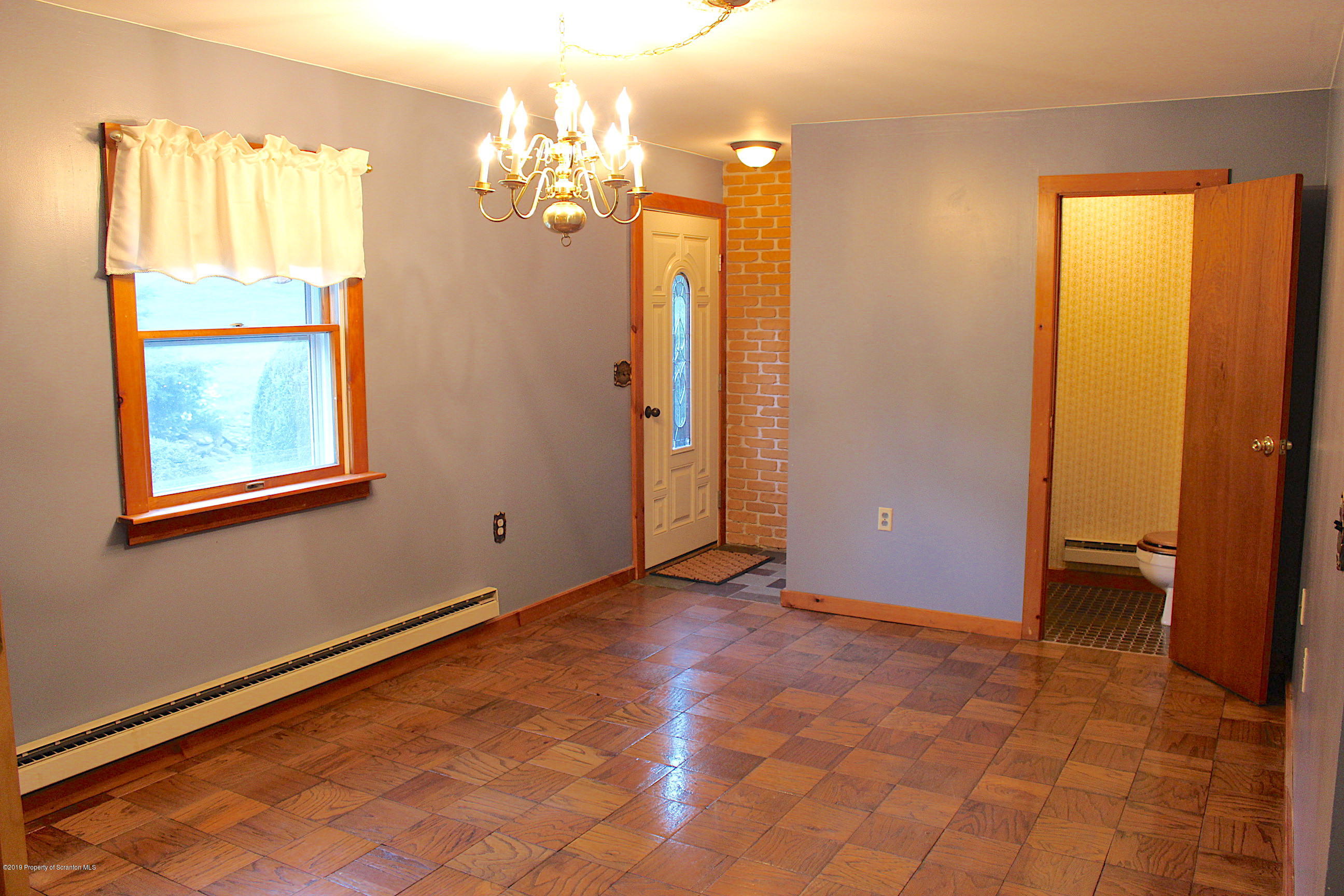 1603 Oak Ridge Road Mehoopany, PA 18629 - Photo 11 of 52 a view of a livingroom with a chandelier