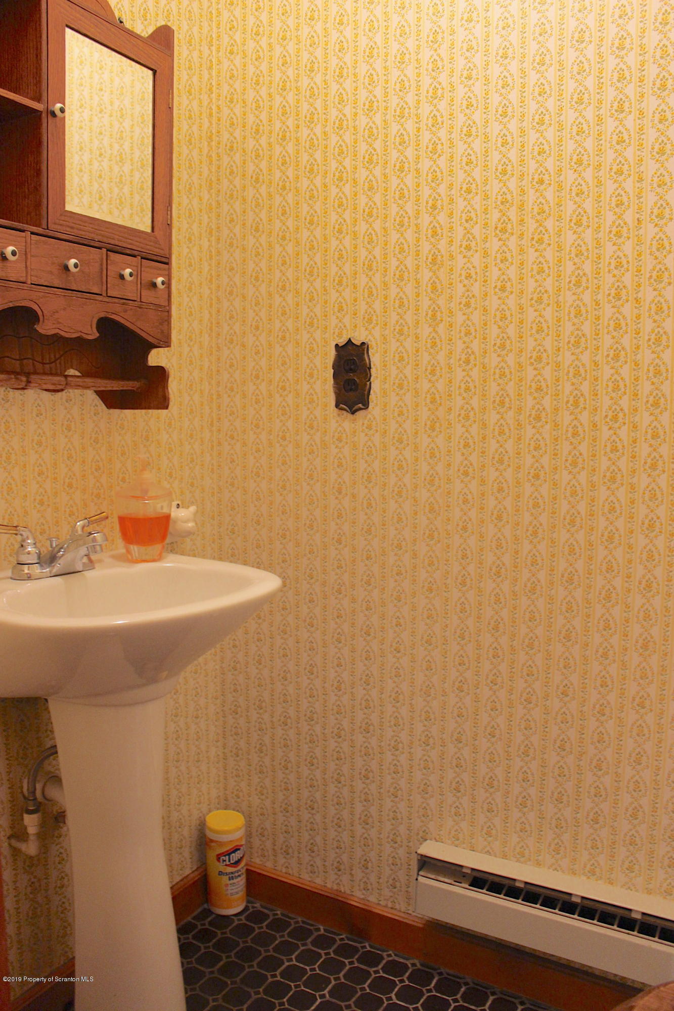1603 Oak Ridge Road Mehoopany, PA 18629 - Photo 12 of 52 a bathroom with a sink a toilet and a mirror