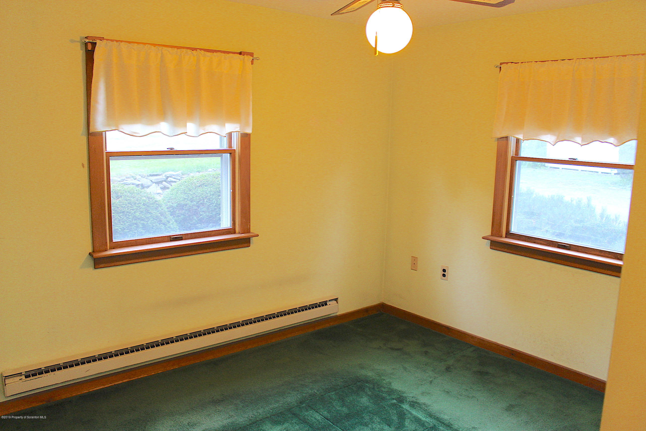 1603 Oak Ridge Road Mehoopany, PA 18629 - Photo 14 of 52 a view of a small space with wooden floor and a window