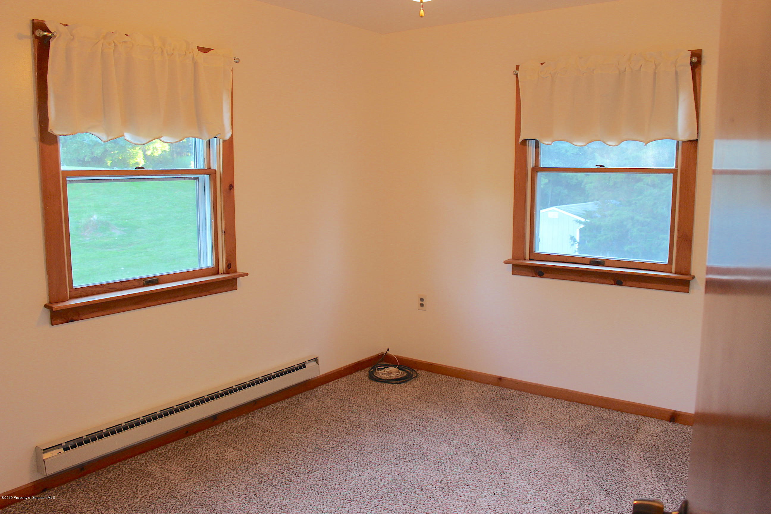 1603 Oak Ridge Road Mehoopany, PA 18629 - Photo 15 of 52 a view of an empty room with a window