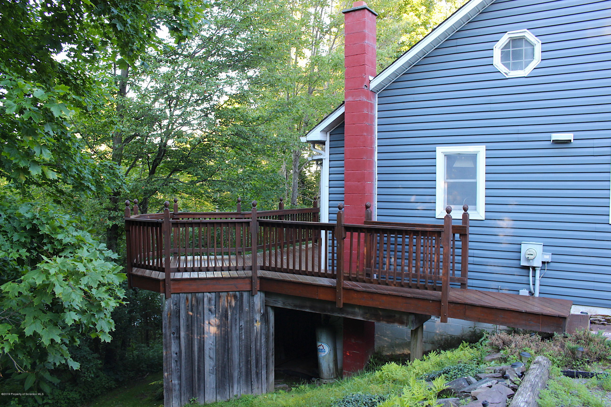 1603 Oak Ridge Road Mehoopany, PA 18629 - Photo 16 of 52 a view of a house with a deck and furniture