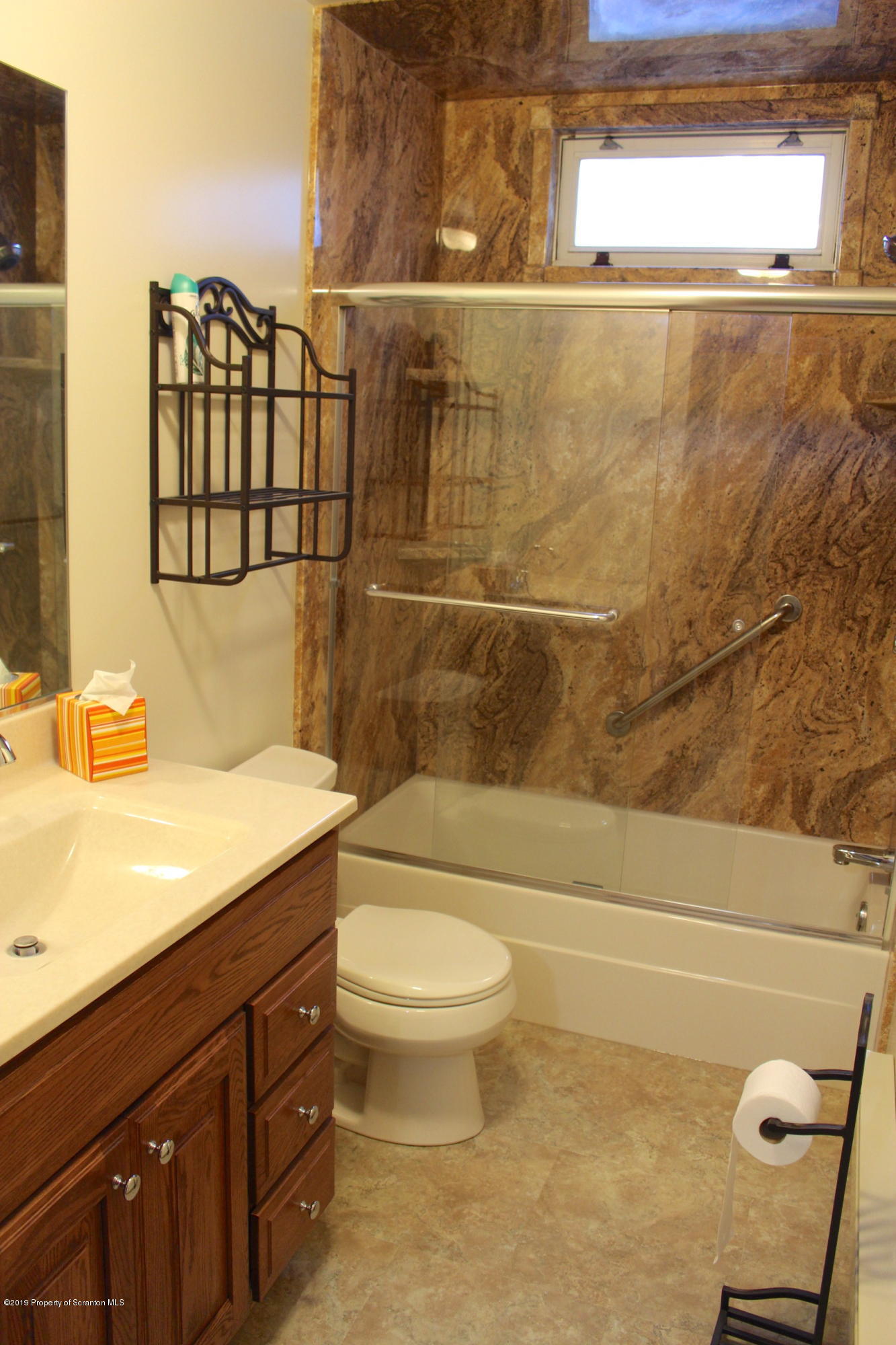 1603 Oak Ridge Road Mehoopany, PA 18629 - Photo 17 of 52 a bathroom with a granite countertop sink a toilet and a bathtub