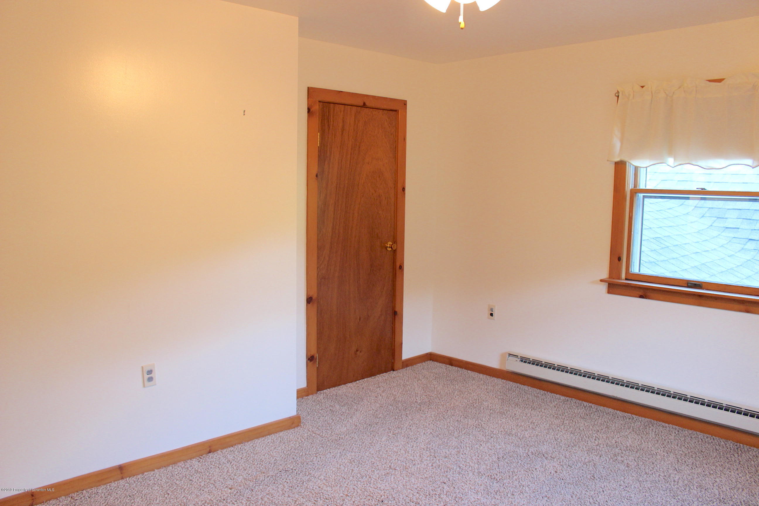 1603 Oak Ridge Road Mehoopany, PA 18629 - Photo 19 of 52 an empty room with windows