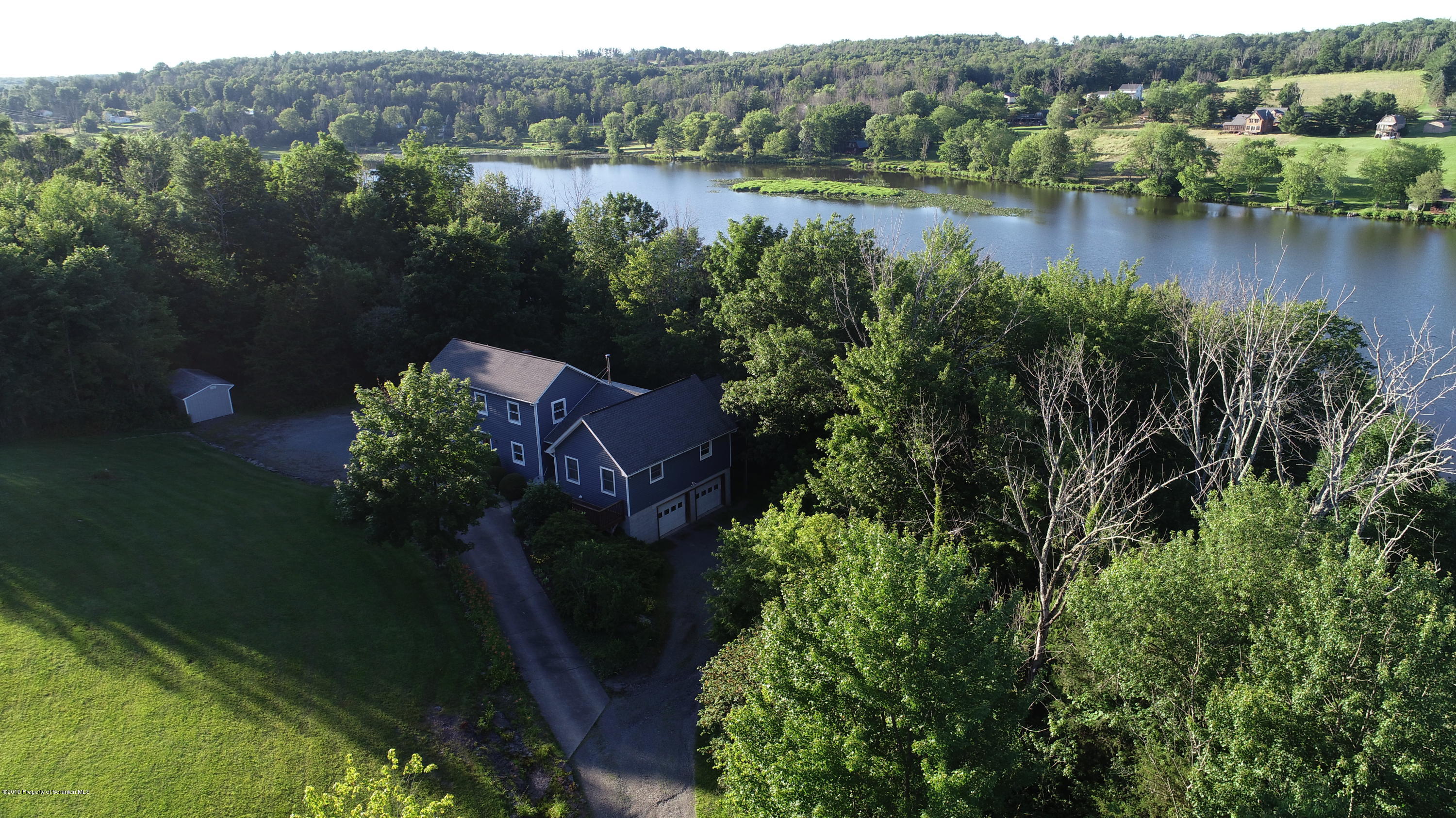 1603 Oak Ridge Road Mehoopany, PA 18629 - Photo 31 of 52 a view of lake with green space