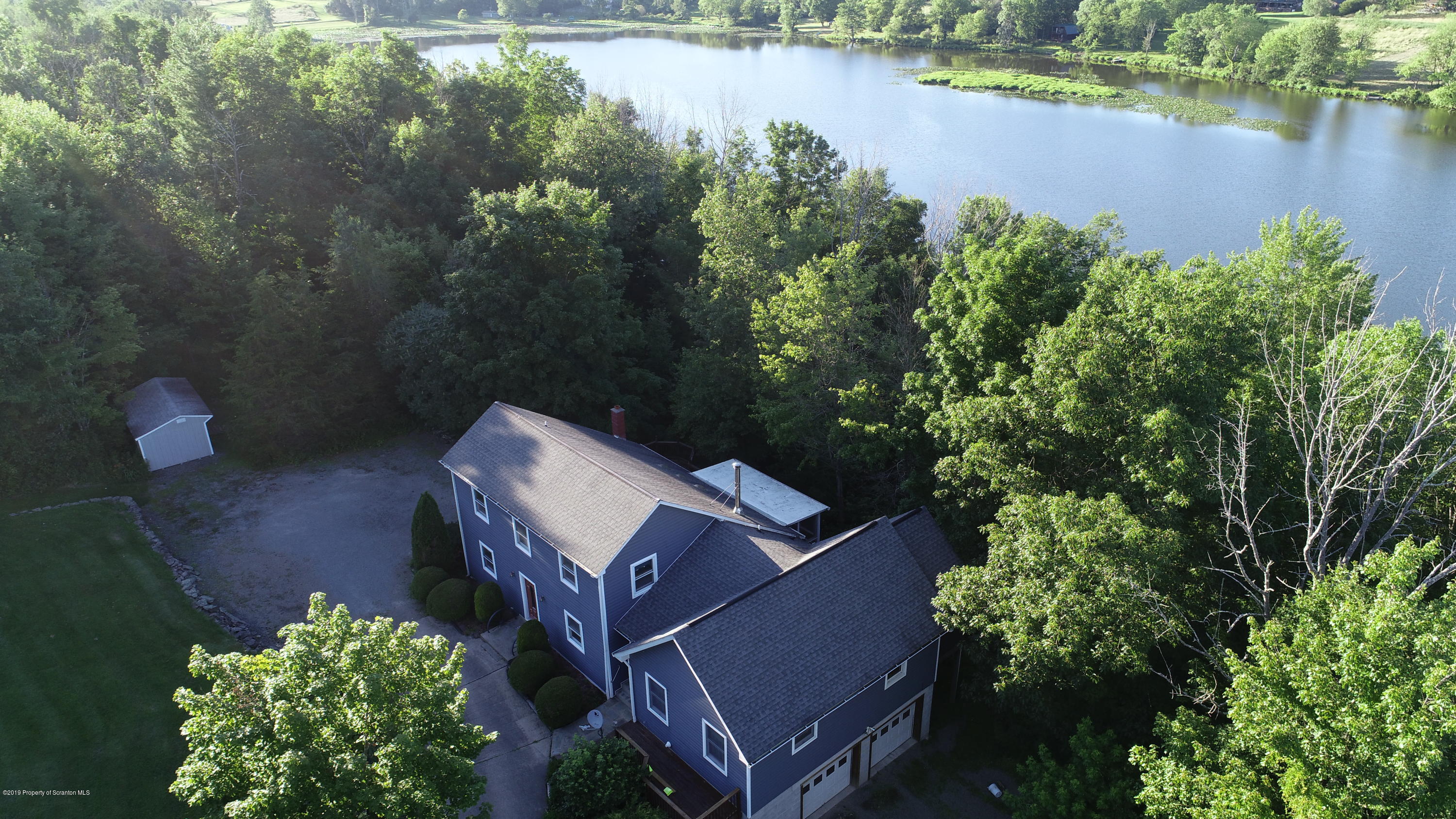 1603 Oak Ridge Road Mehoopany, PA 18629 - Photo 32 of 52 an aerial view of a house with a lake view