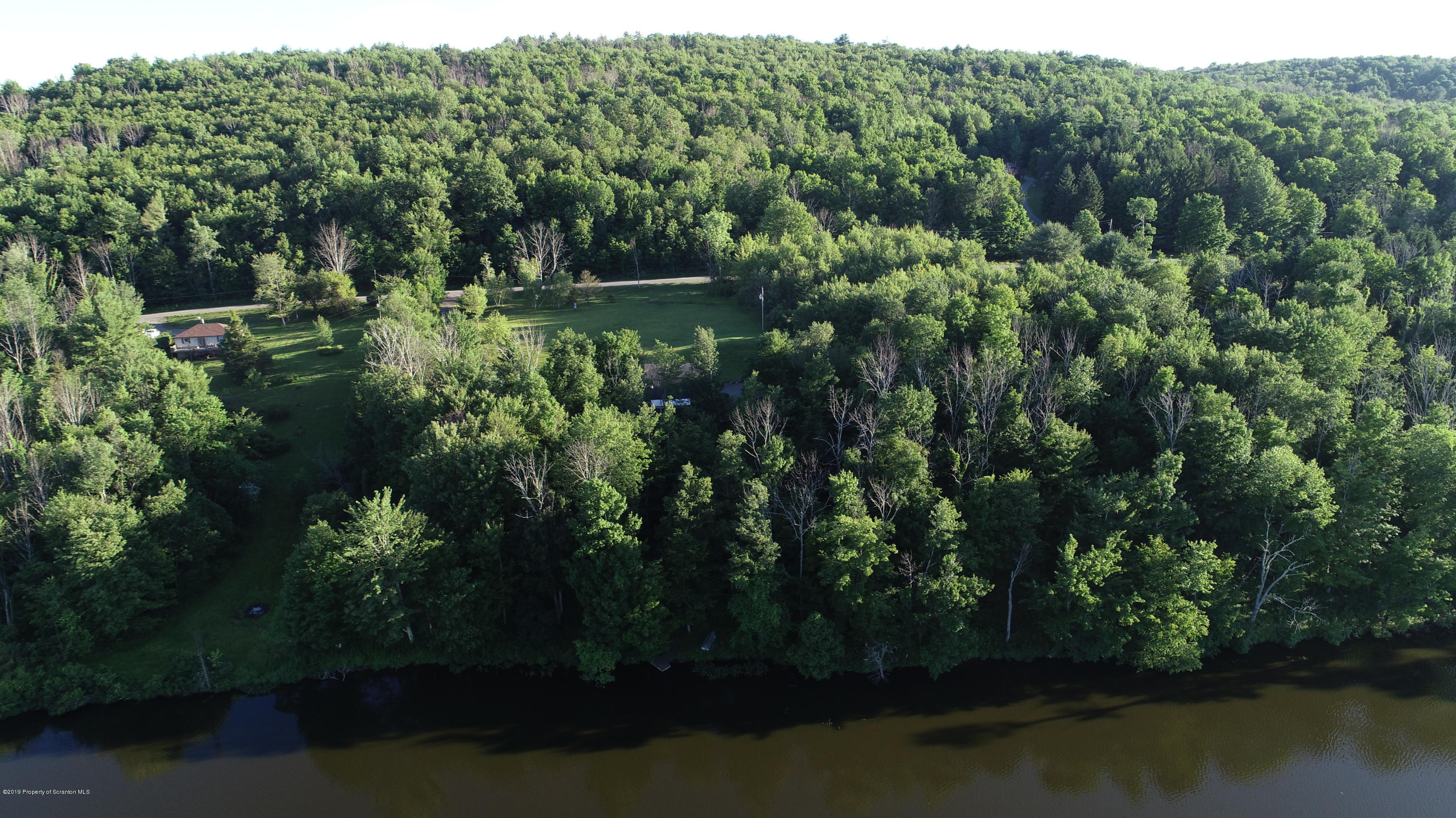 1603 Oak Ridge Road Mehoopany, PA 18629 - Photo 42 of 52 a view of a lake with a city