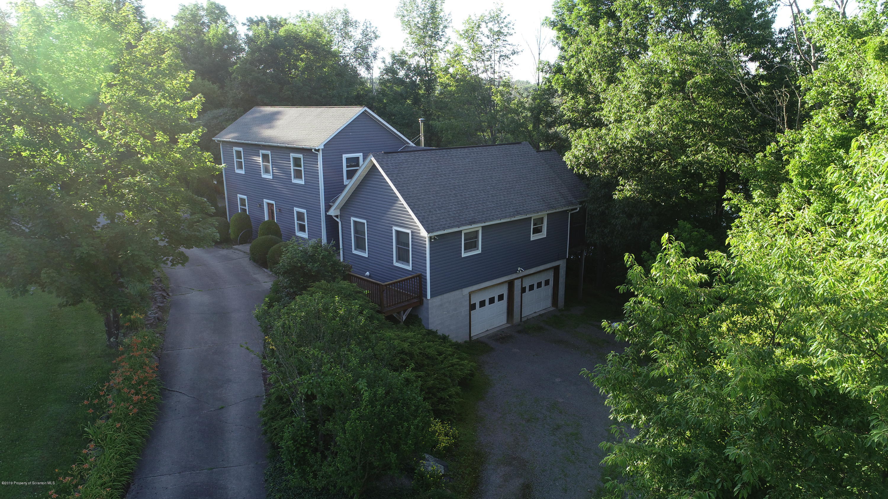 1603 Oak Ridge Road Mehoopany, PA 18629 - Photo 50 of 52 an aerial view of a house with yard and outdoor seating