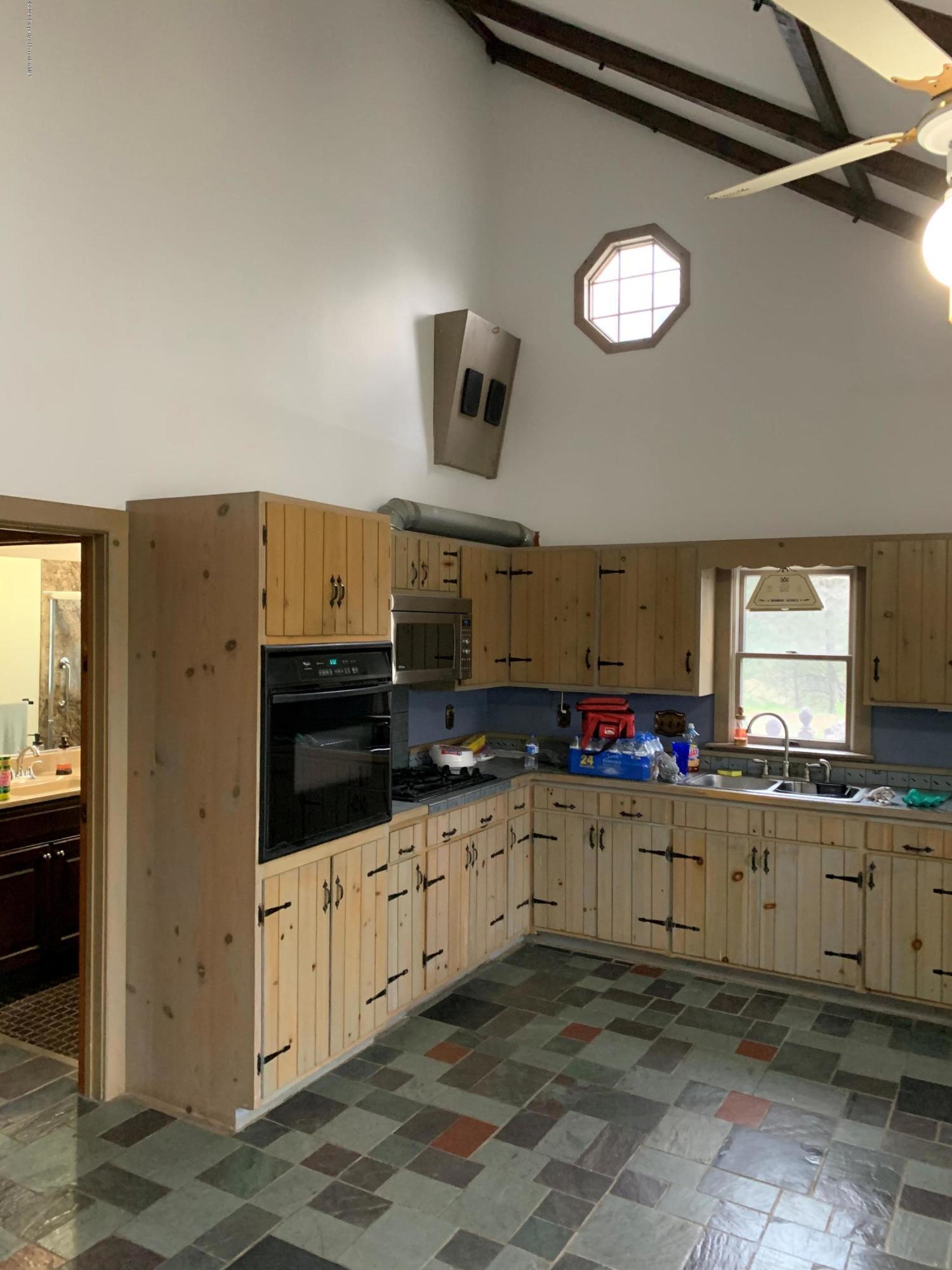 1603 Oak Ridge Road Mehoopany, PA 18629 - Photo 5 of 52 a kitchen with granite countertop a sink and a stove