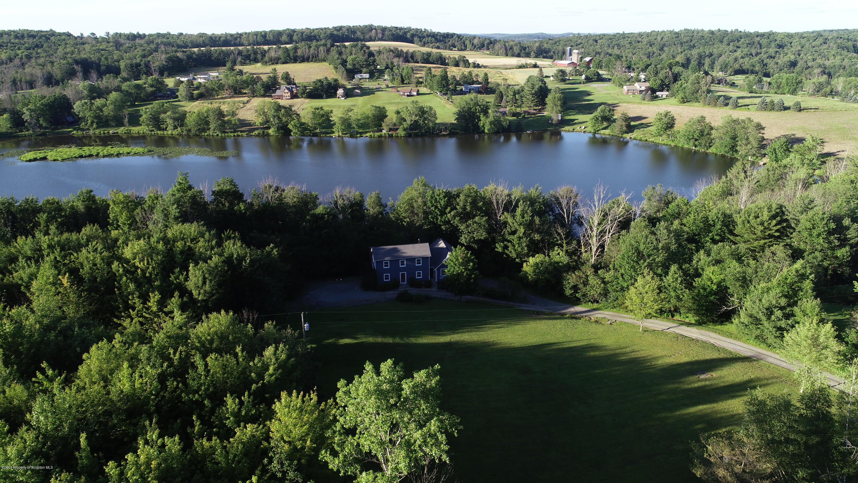 1603 Oak Ridge Road Mehoopany, PA 18629 - Photo 51 of 52 a view of a lake with a city