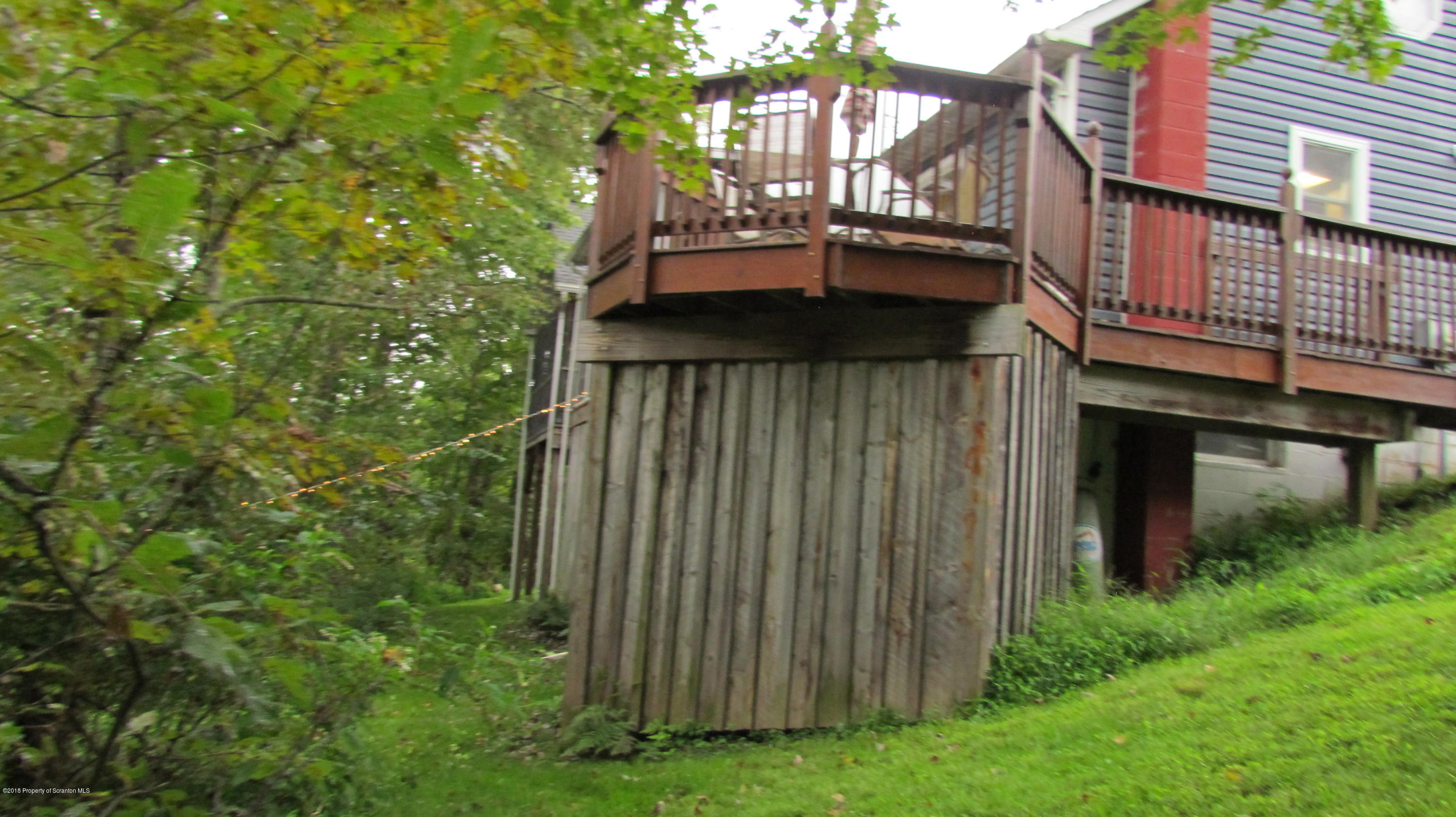 1603 Oak Ridge Road Mehoopany, PA 18629 - Photo 8 of 52 a view of a small house with a small yard