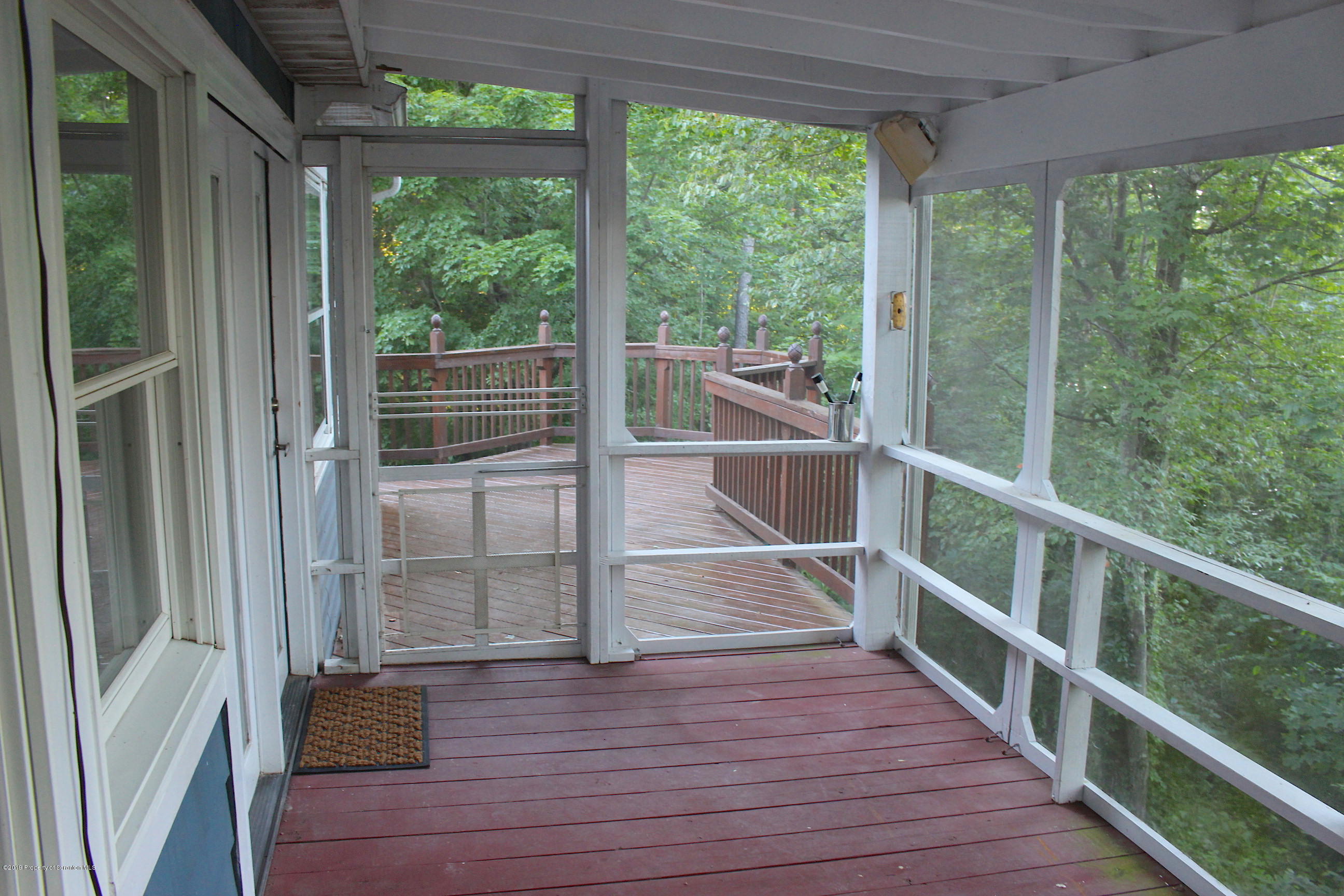 1603 Oak Ridge Road Mehoopany, PA 18629 - Photo 9 of 52 a view of a balcony with wooden floor