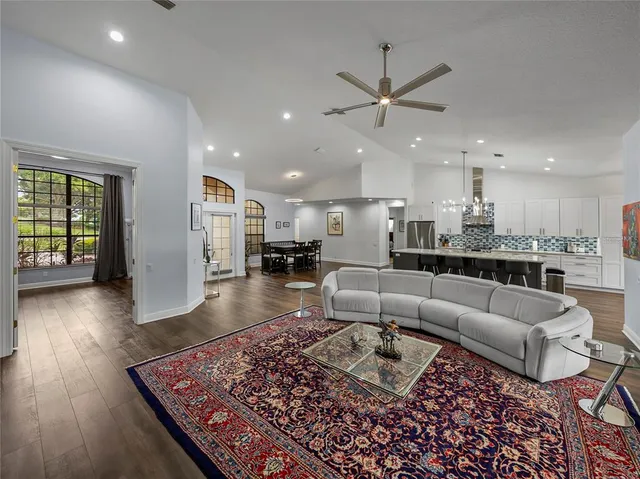 a living room with furniture and a rug