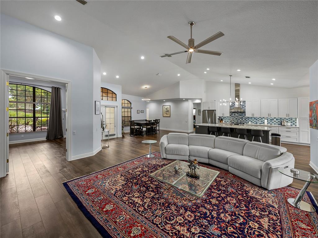 34120 Americana Avenue Dade City, FL 33525 - Photo 11 of 71 a living room with furniture and a wooden floor