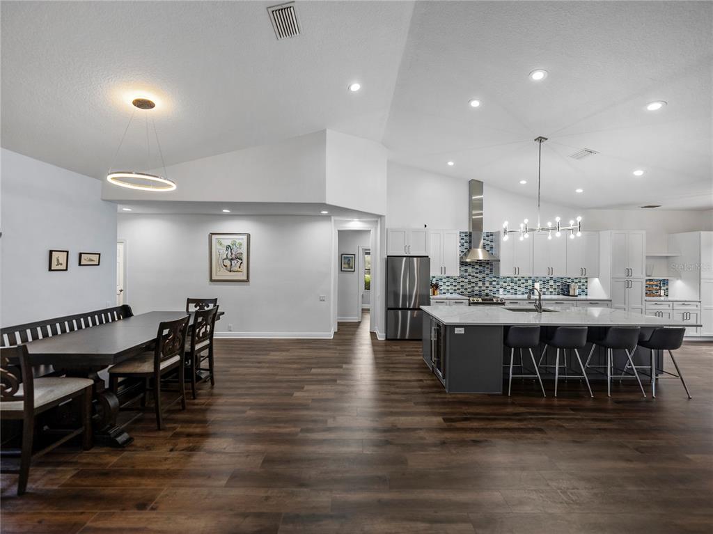 34120 Americana Avenue Dade City, FL 33525 - Photo 15 of 71 a large kitchen with a table and chairs