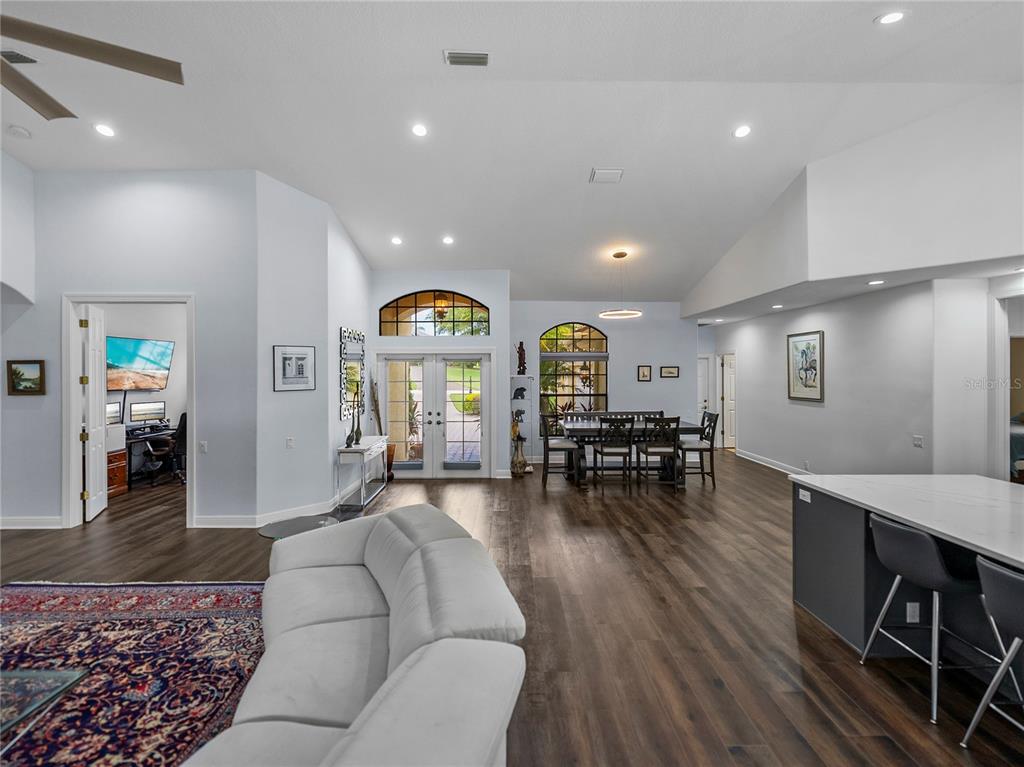 34120 Americana Avenue Dade City, FL 33525 - Photo 27 of 71 a living room with furniture and wooden floor