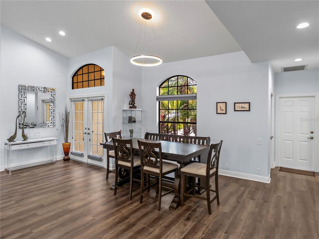 34120 Americana Avenue Dade City, FL 33525 - Photo 28 of 71 a view of a dining room with furniture and wooden floor