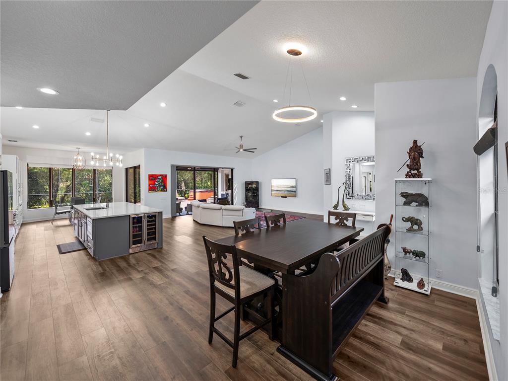 34120 Americana Avenue Dade City, FL 33525 - Photo 29 of 71 a large kitchen with a table and chairs in it