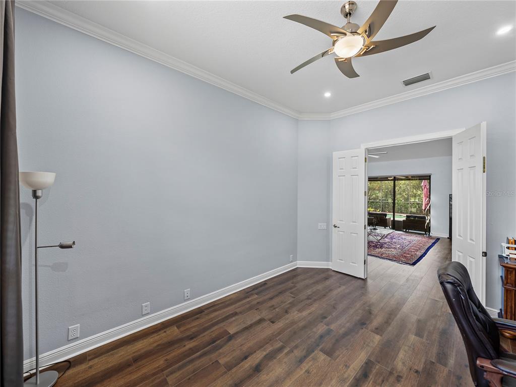 34120 Americana Avenue Dade City, FL 33525 - Photo 39 of 71 wooden floor in an empty room with a window
