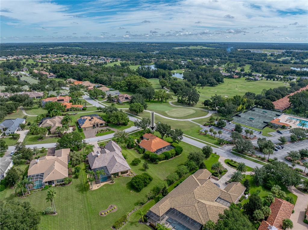 34120 Americana Avenue Dade City, FL 33525 - Photo 4 of 71 an aerial view of a city with lots of residential buildings