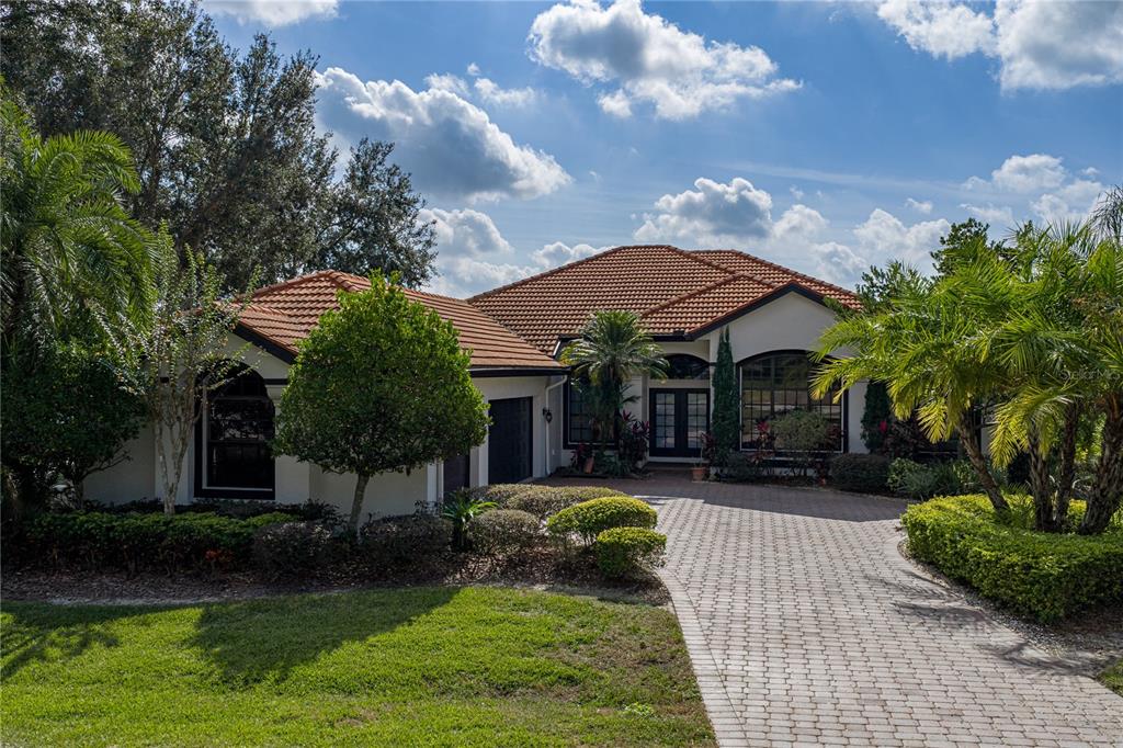 34120 Americana Avenue Dade City, FL 33525 - Photo 7 of 71 a view of a house with backyard and sitting area