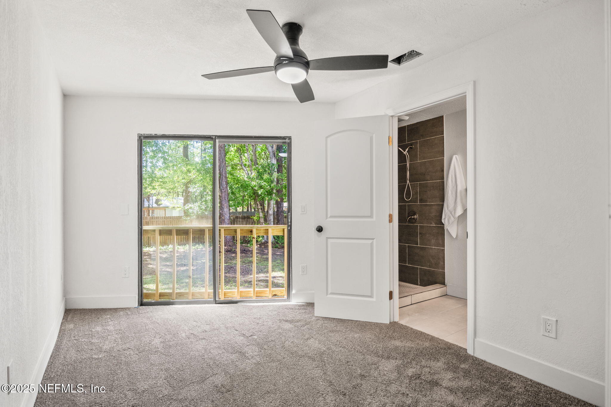 10024 Sandler Road Jacksonville, FL 32222 - Photo 20 of 40 a view of an empty room with a window