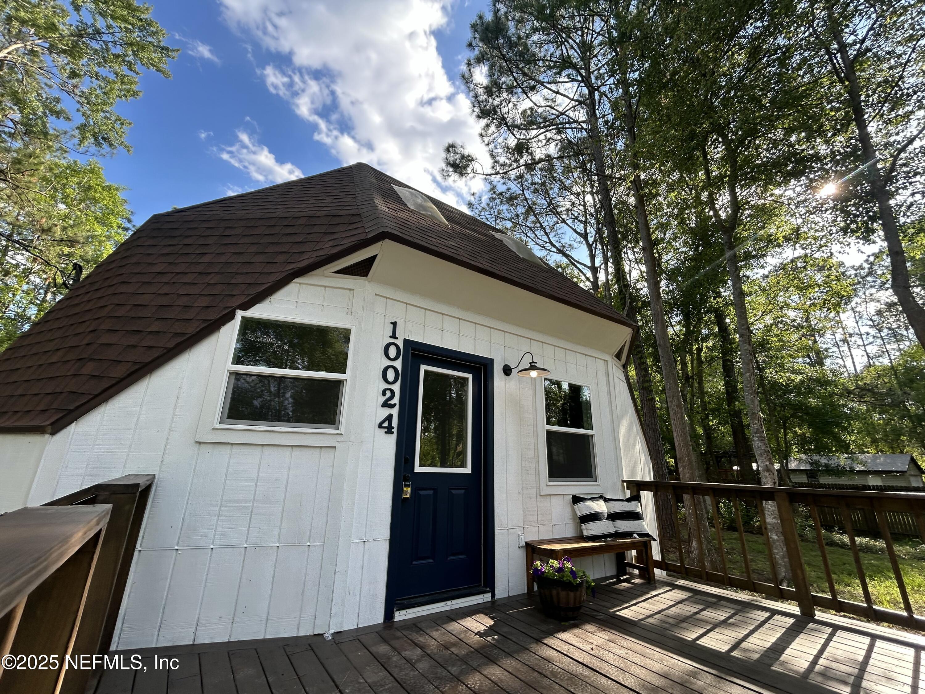 10024 Sandler Road Jacksonville, FL 32222 - Photo 2 of 40 a view of house with backyard and seating area