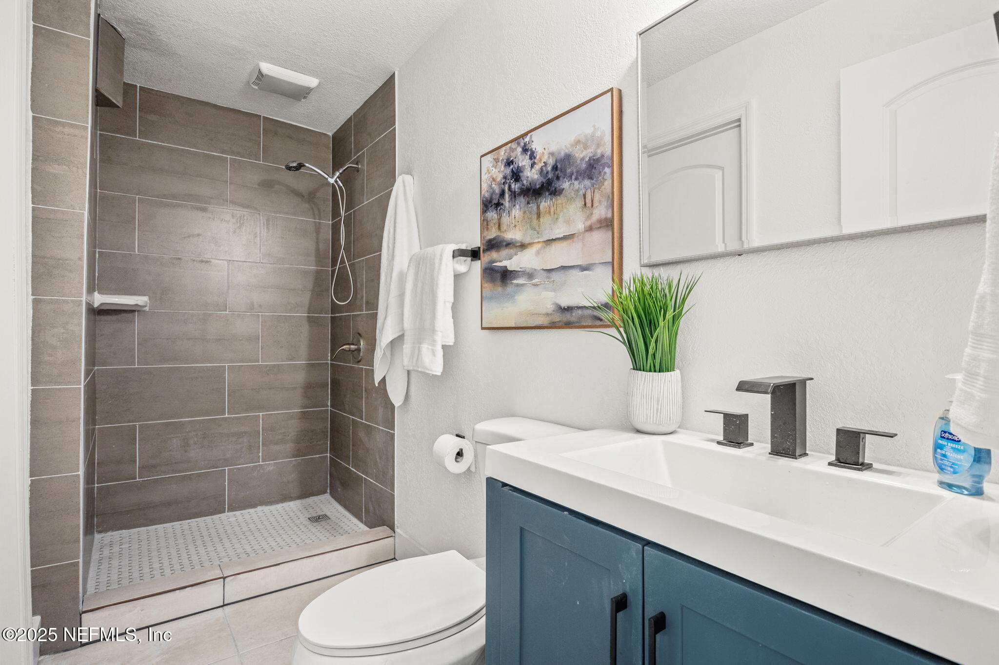 10024 Sandler Road Jacksonville, FL 32222 - Photo 21 of 40 a bathroom with a sink a toilet and shower