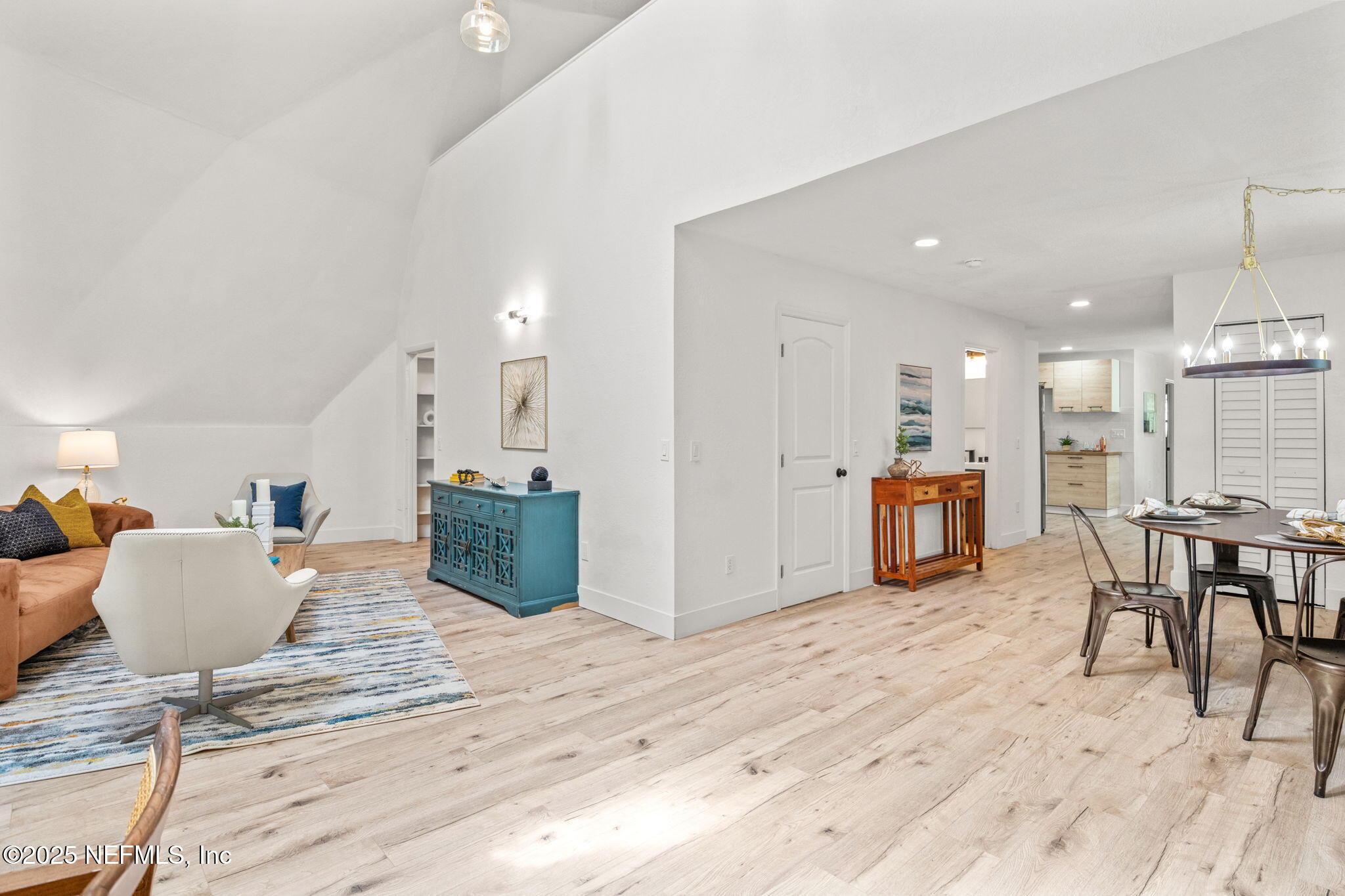 10024 Sandler Road Jacksonville, FL 32222 - Photo 23 of 40 a living room with furniture a wooden floor and kitchen view