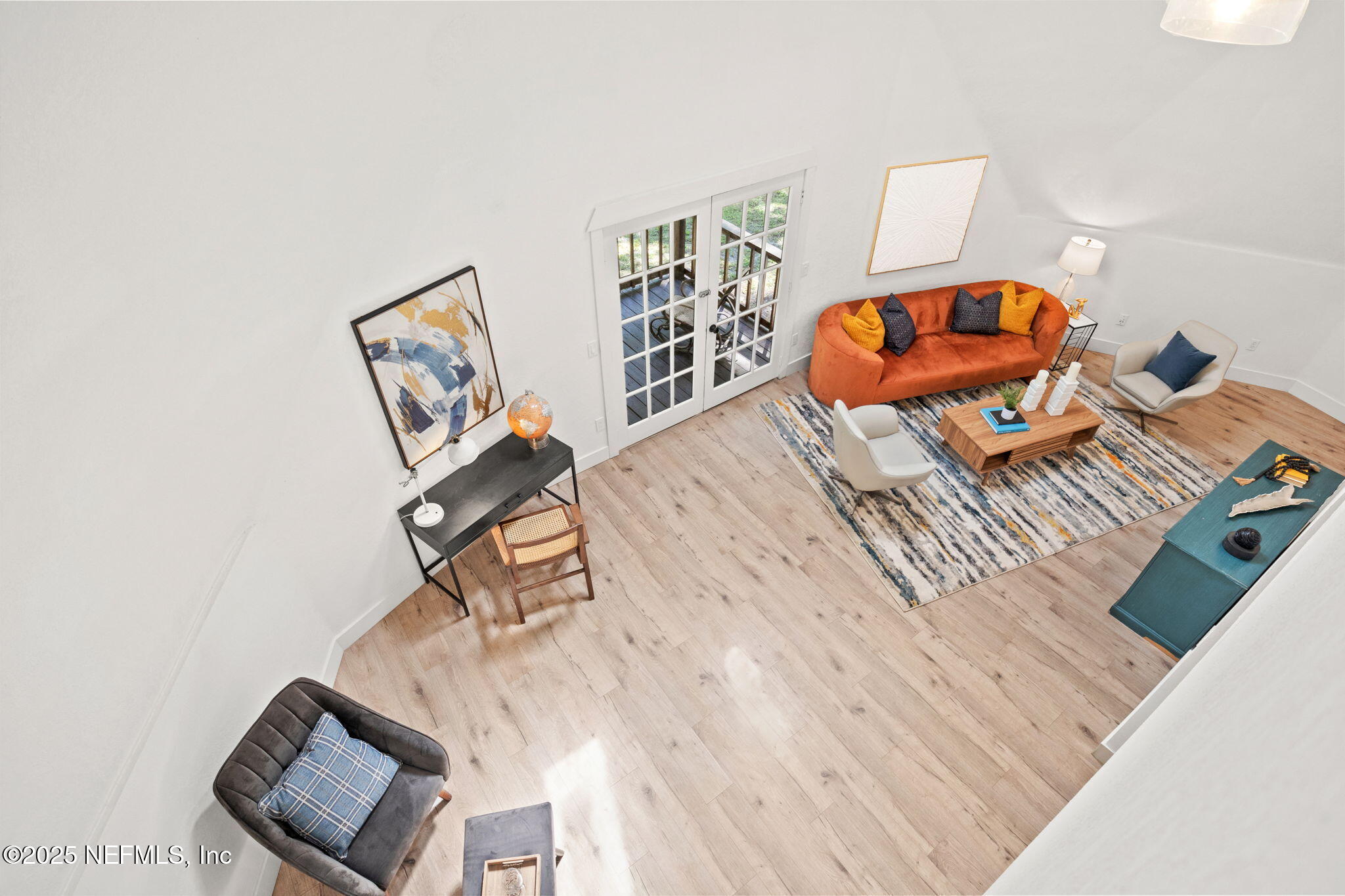 10024 Sandler Road Jacksonville, FL 32222 - Photo 26 of 40 a living room with a rug and a wooden floor
