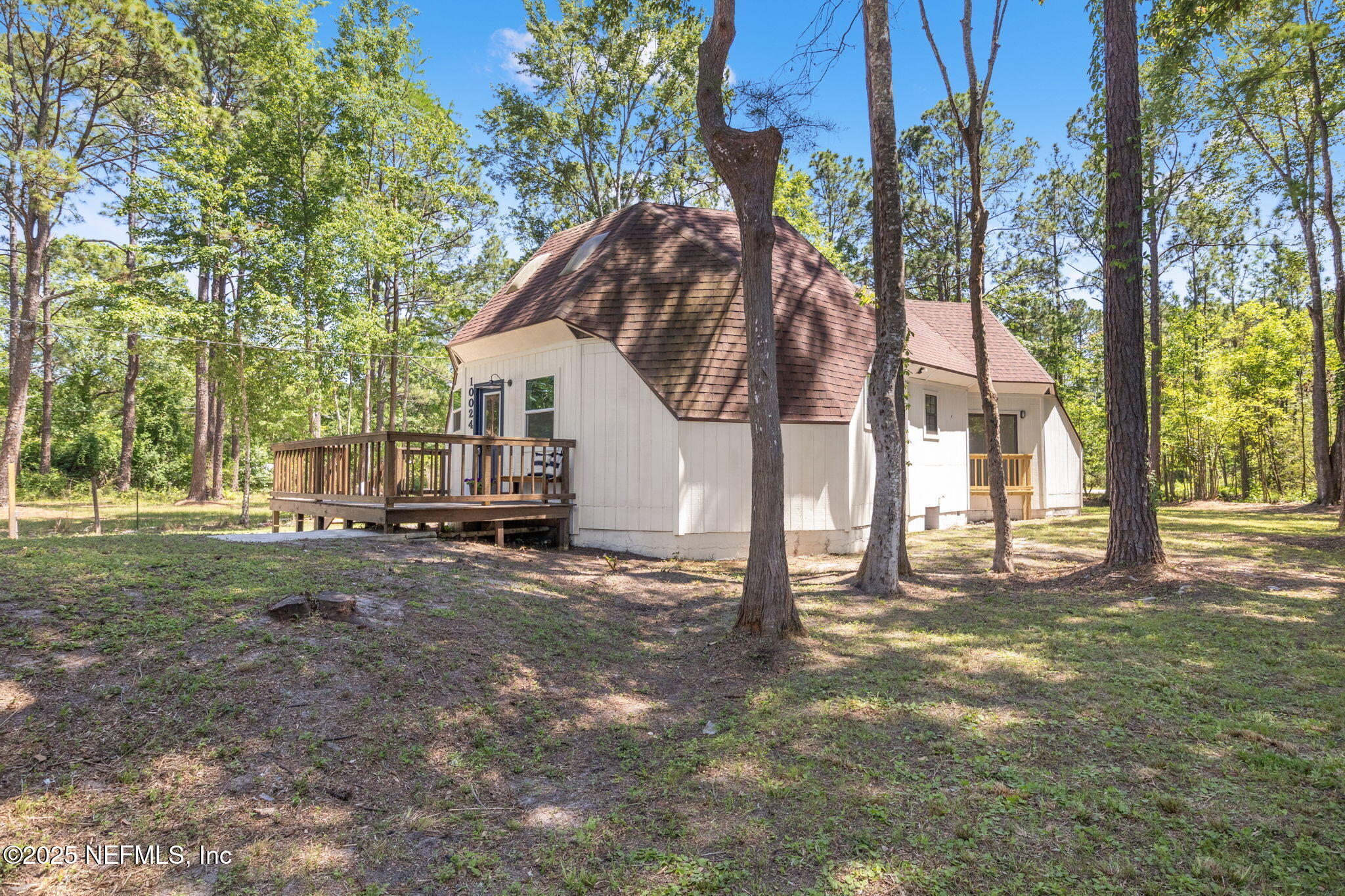 10024 Sandler Road Jacksonville, FL 32222 - Photo 3 of 40 a view of a house with backyard and trees