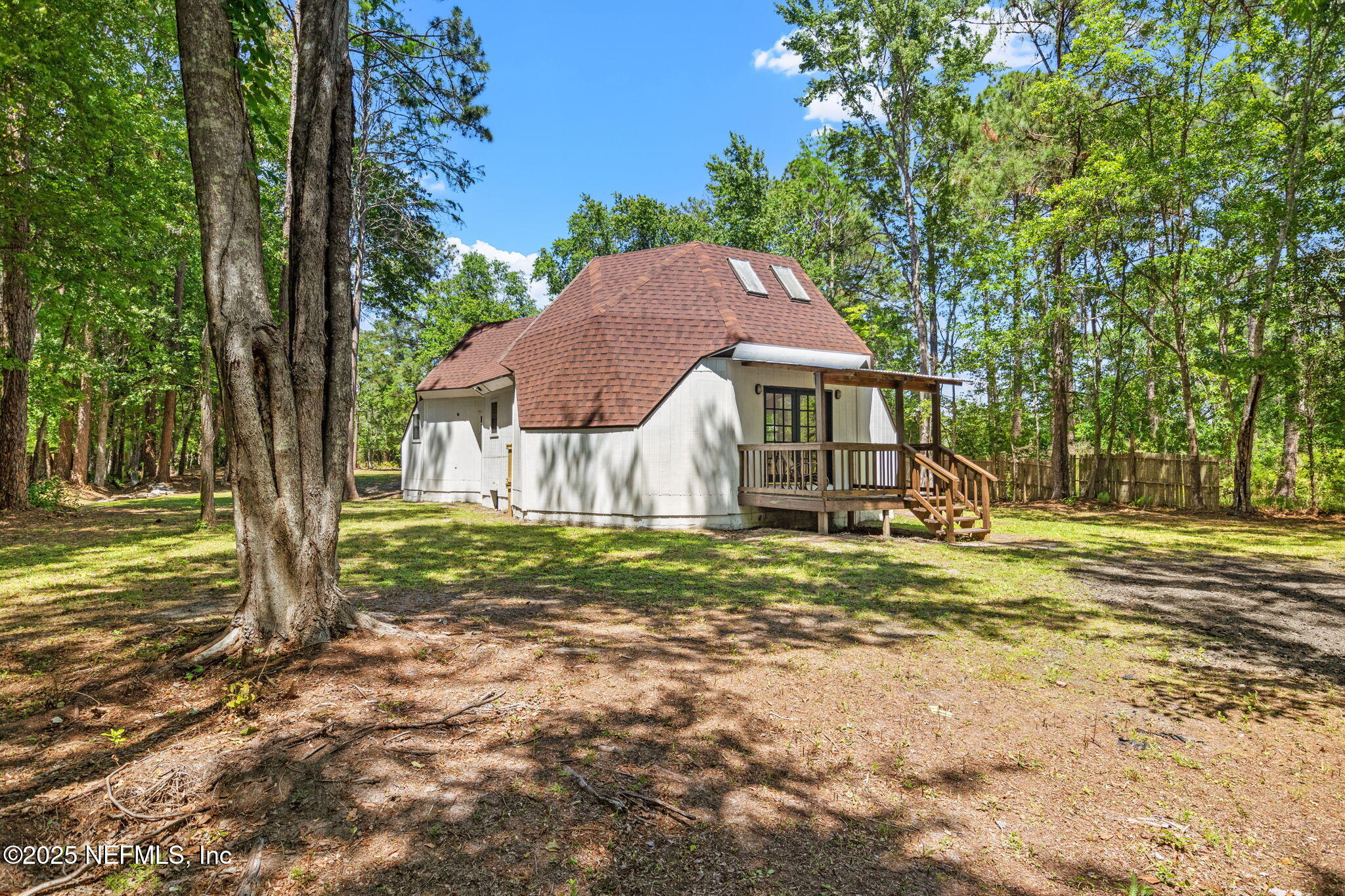 10024 Sandler Road Jacksonville, FL 32222 - Photo 31 of 40 a house with huge green field in front of it