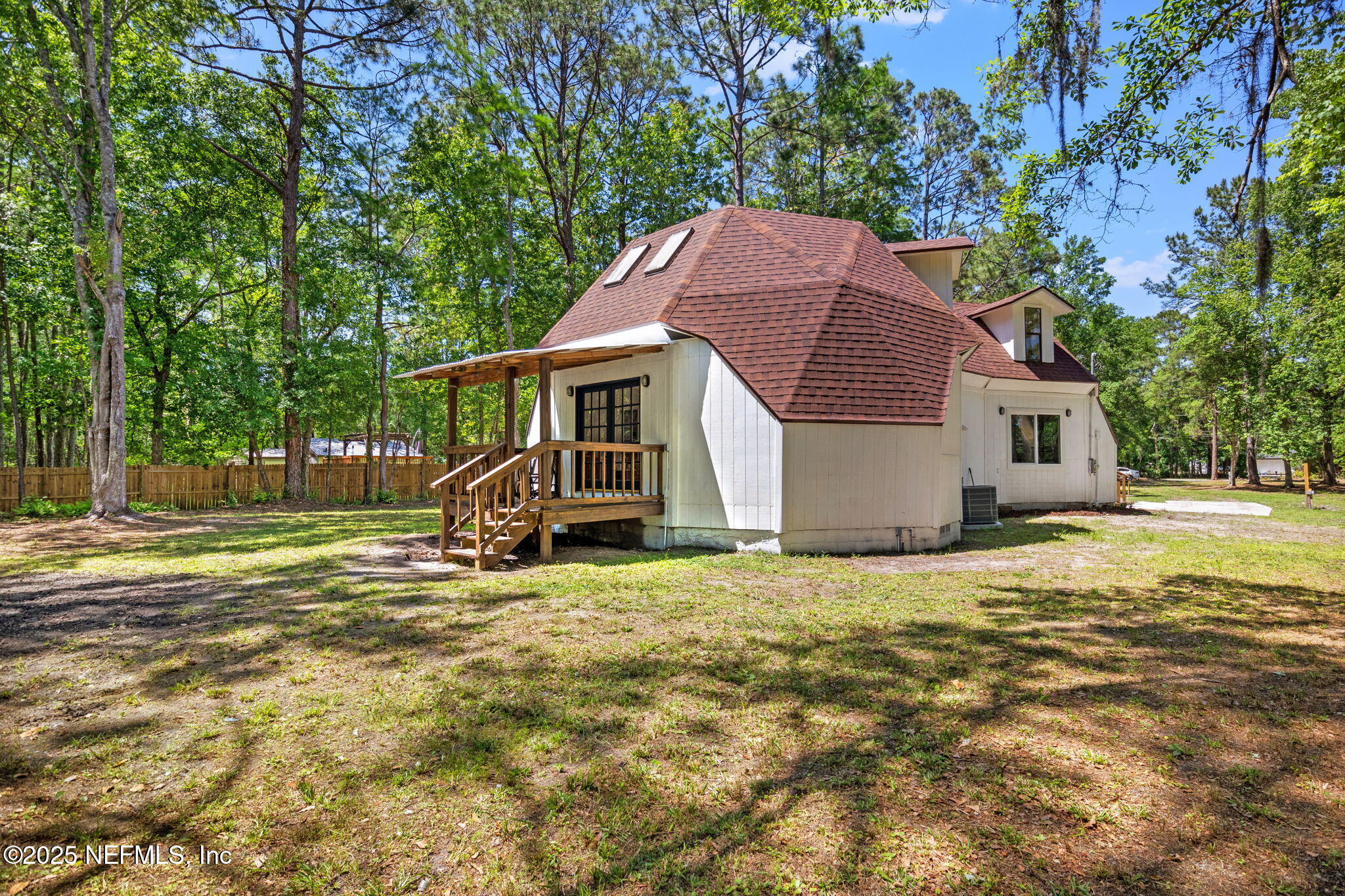 10024 Sandler Road Jacksonville, FL 32222 - Photo 32 of 40 a view of a house with backyard and a tree