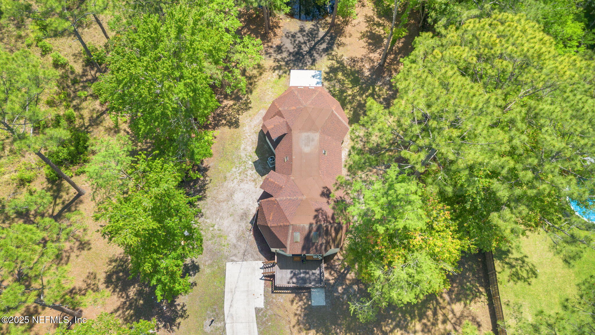 10024 Sandler Road Jacksonville, FL 32222 - Photo 36 of 40 an aerial view of a house with a yard and large trees
