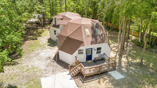 a view of a city with lush green forest