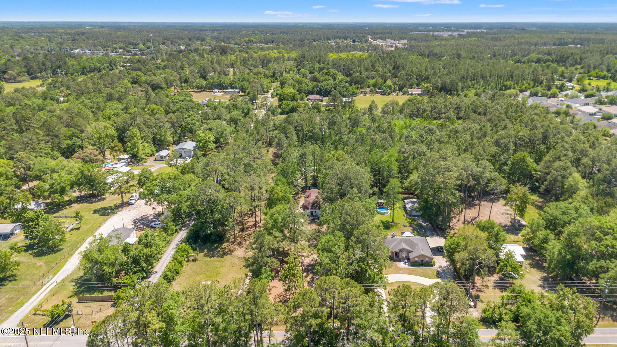 10024 Sandler Road Jacksonville, FL 32222 - Photo 38 of 40 a view of a city with lush green forest