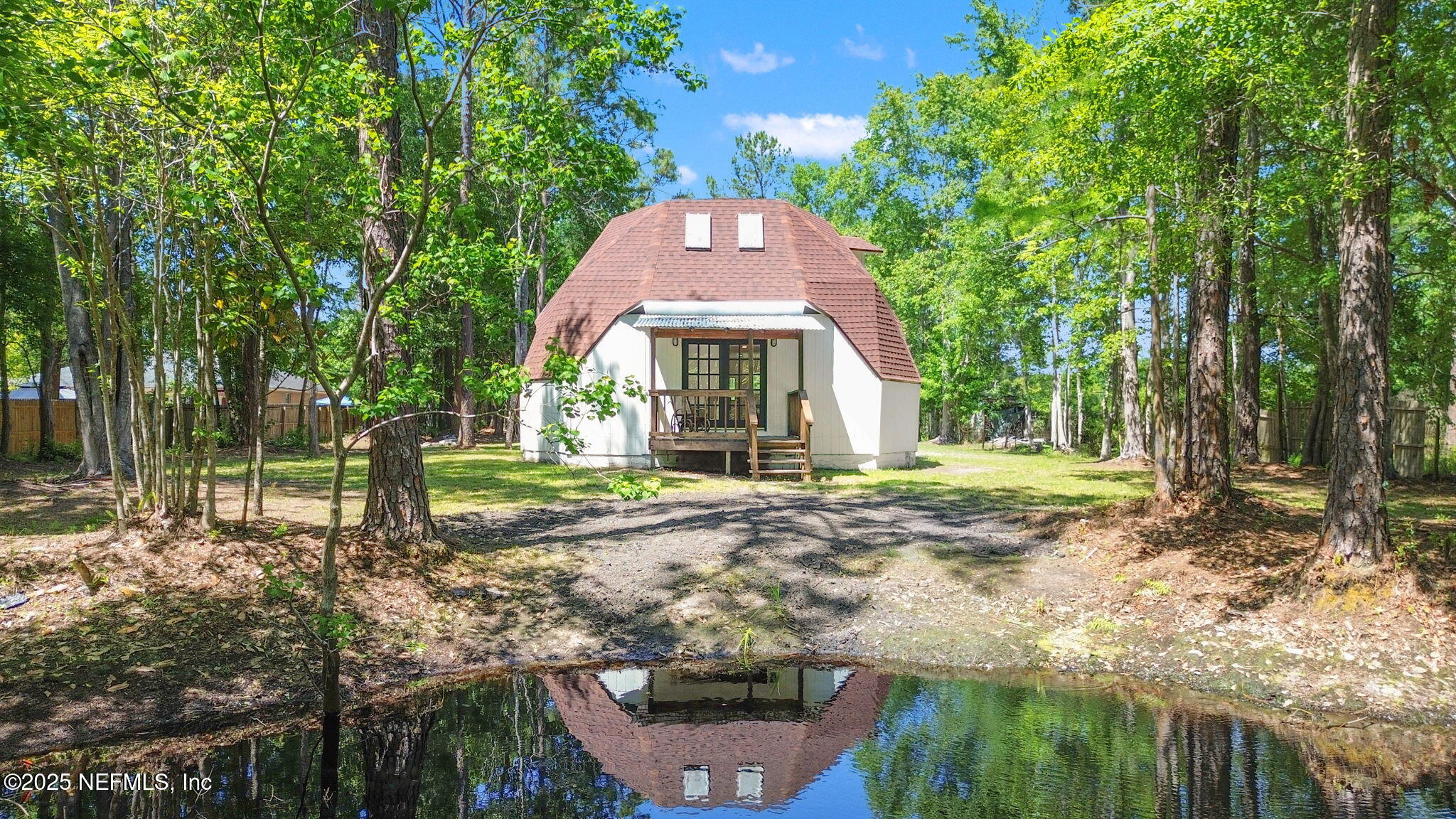 10024 Sandler Road Jacksonville, FL 32222 - Photo 40 of 40 a front view of a house with garden