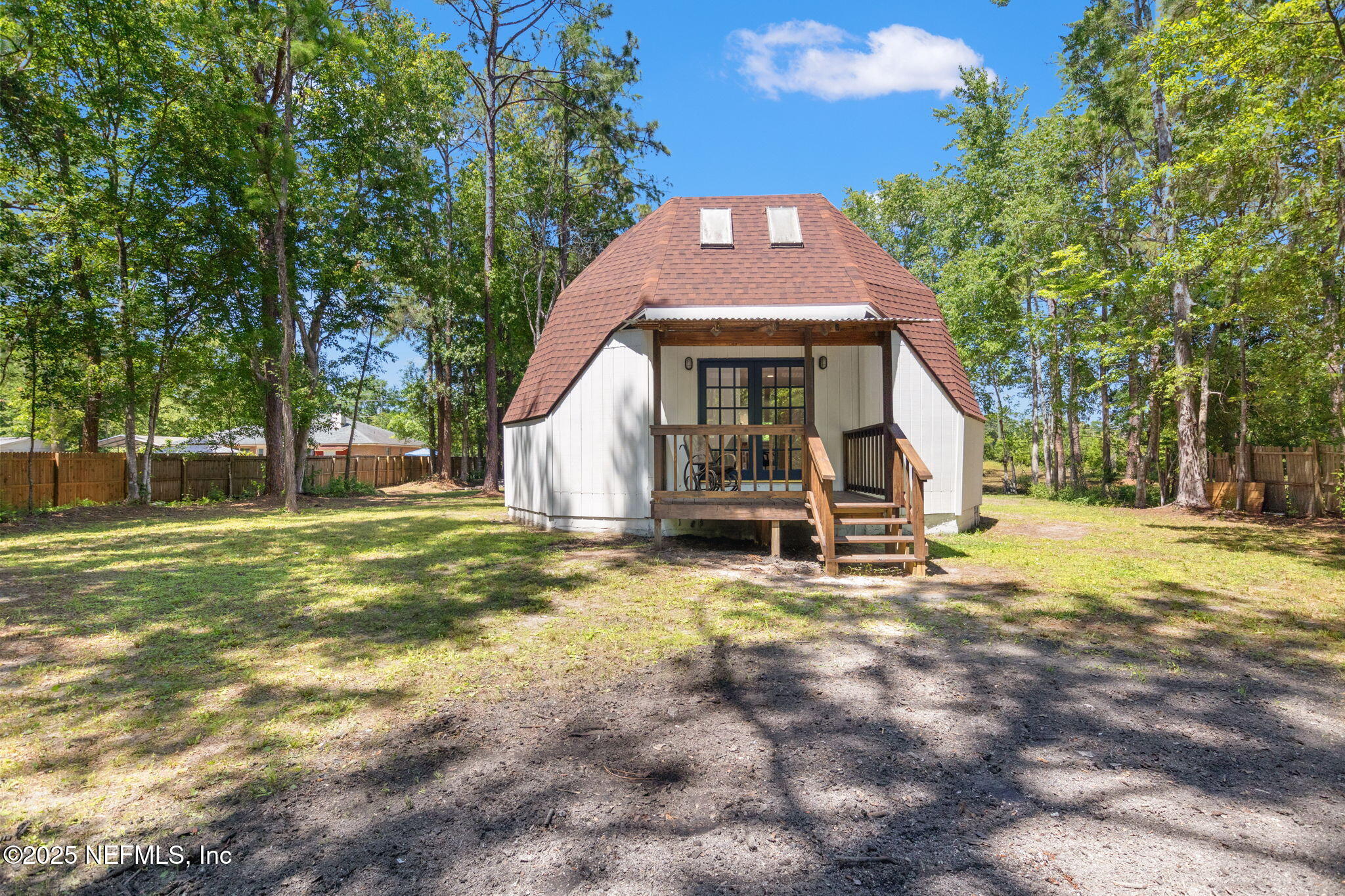 10024 Sandler Road Jacksonville, FL 32222 - Photo 4 of 40 a front view of a house with a yard