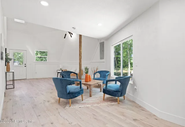 a living room with furniture and window