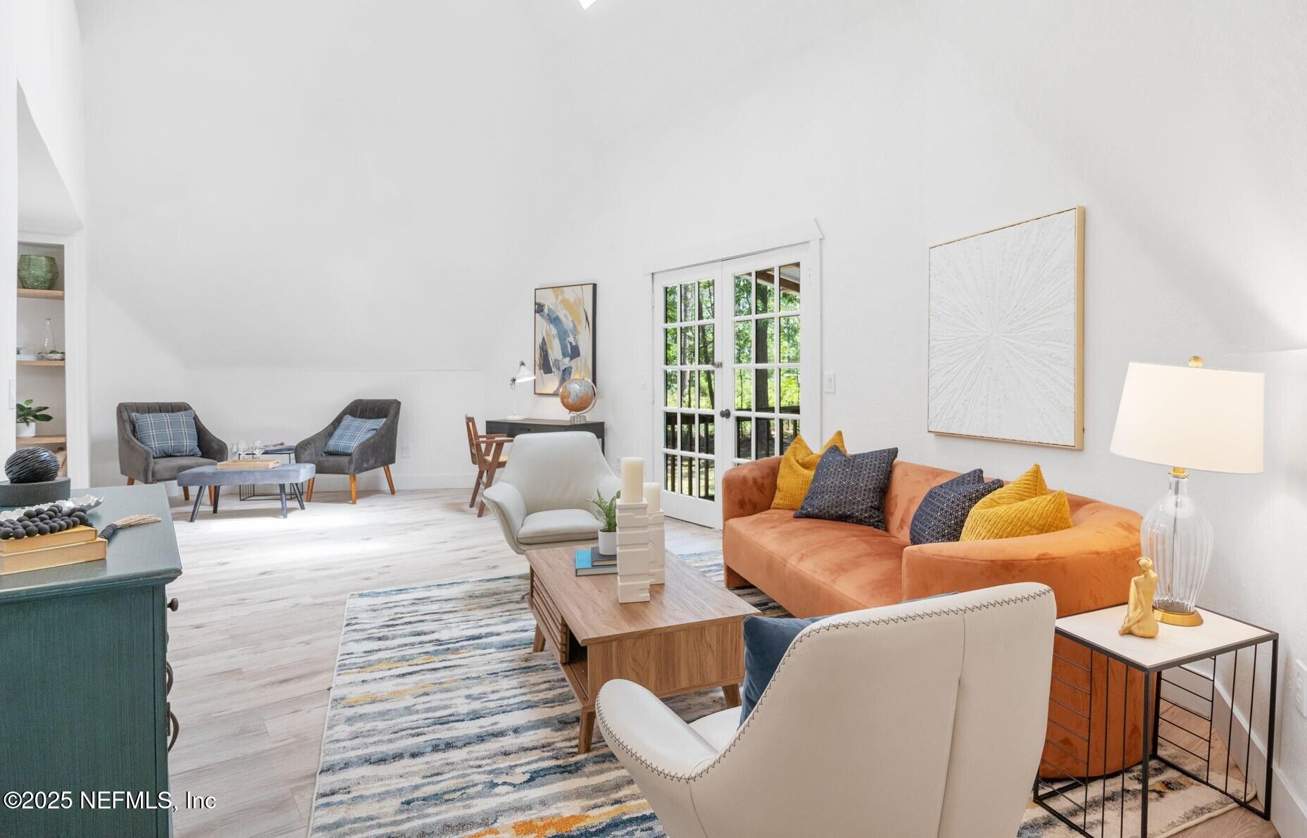 10024 Sandler Road Jacksonville, FL 32222 - Photo 6 of 40 a living room with furniture and a large window