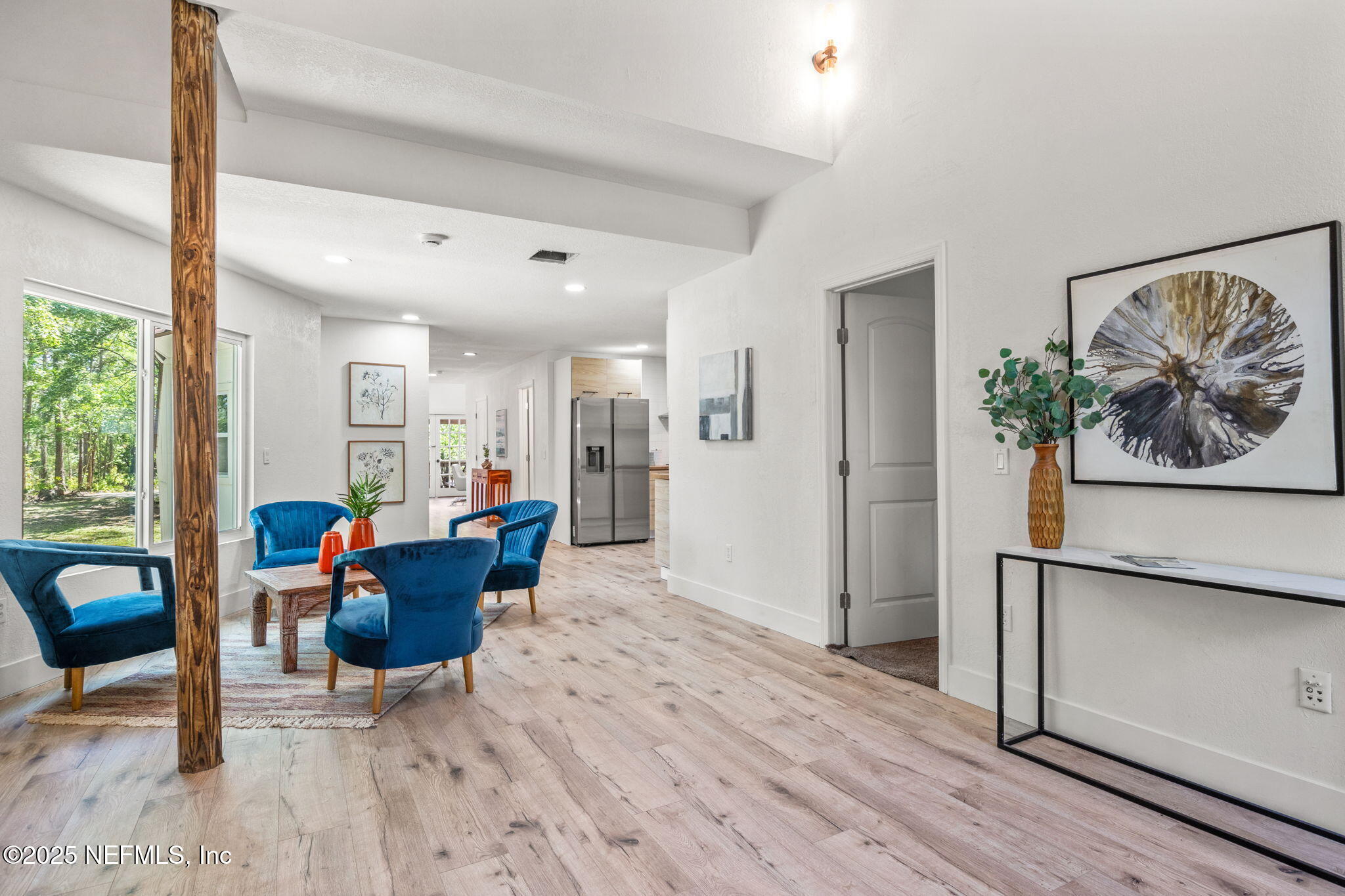10024 Sandler Road Jacksonville, FL 32222 - Photo 9 of 40 a living room with furniture and a wooden floor