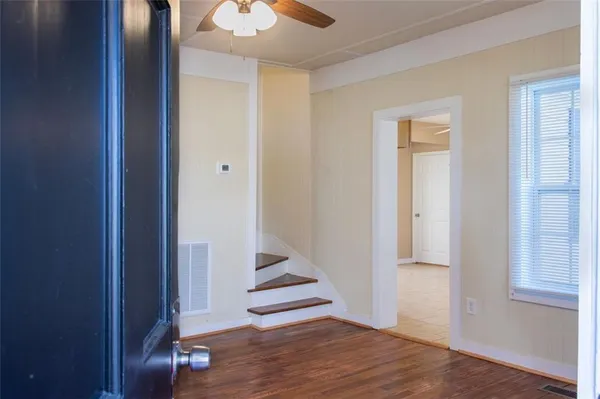 a view of entryway with wooden floor