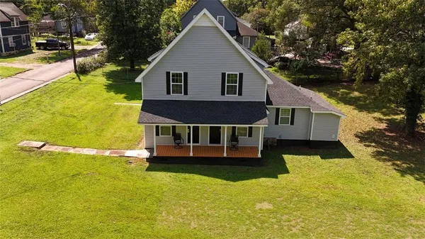 a view of a house with pool yard and front view of a house