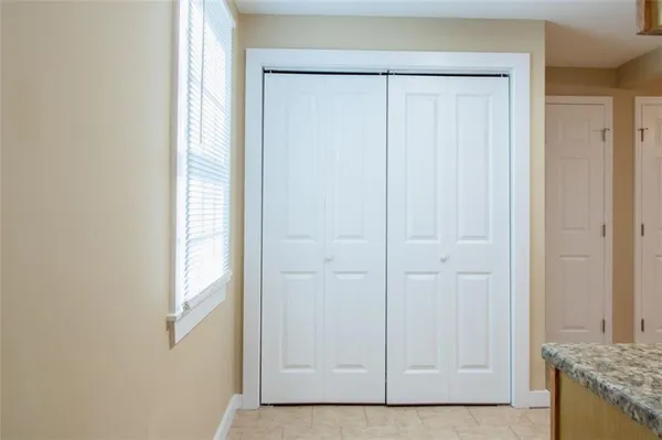 a view of an entryway with kitchen