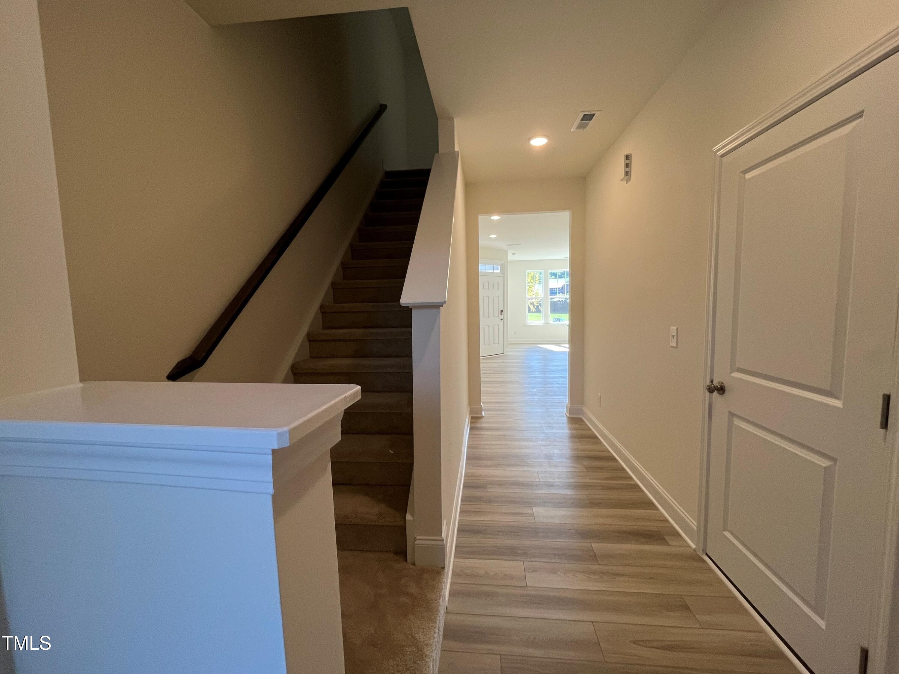 6125 Arsenal Avenue Raleigh, NC 27610 - Photo 12 of 49 Foyer leading to back staircase