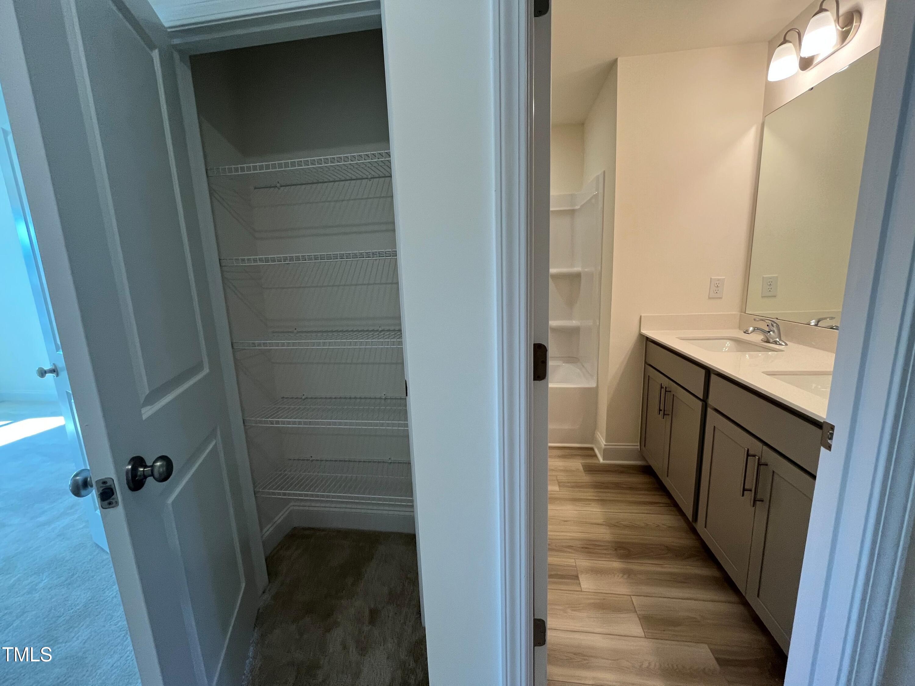 6125 Arsenal Avenue Raleigh, NC 27610 - Photo 18 of 49 Hallway linen closet for guest bath