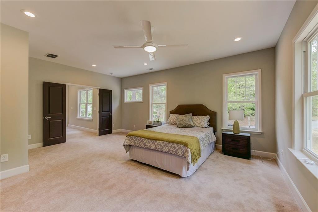 1922 Brannen Road Southeast Atlanta, GA 30316 - Photo 11 of 21 a spacious bedroom with a bed and a large window