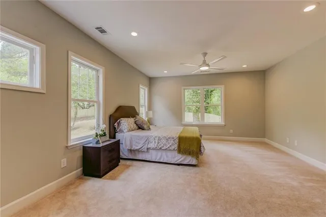 a bed room with furniture and a window