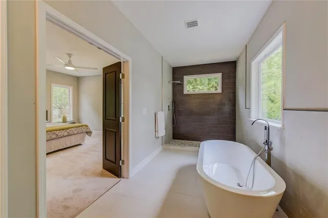 a en suite bathroom with a toilet sink and tub