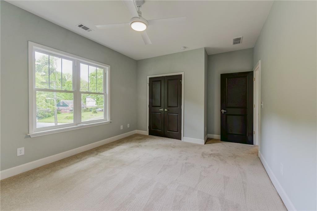 1922 Brannen Road Southeast Atlanta, GA 30316 - Photo 18 of 21 a view of an empty room with window and closet area